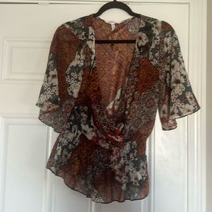 BCBGeneration size medium pattern blouse gathered waist wrap style